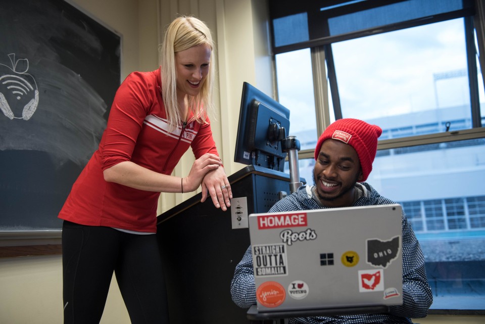 Instructor speaking to student on their laptop