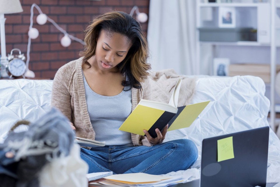 Female student reading a book