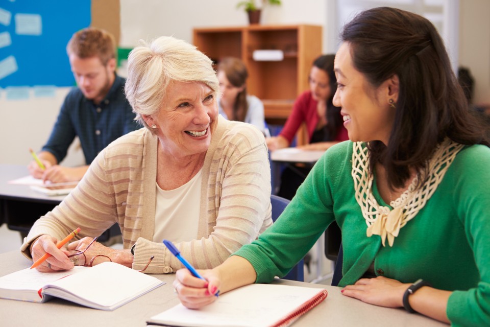 Older and younger student talking