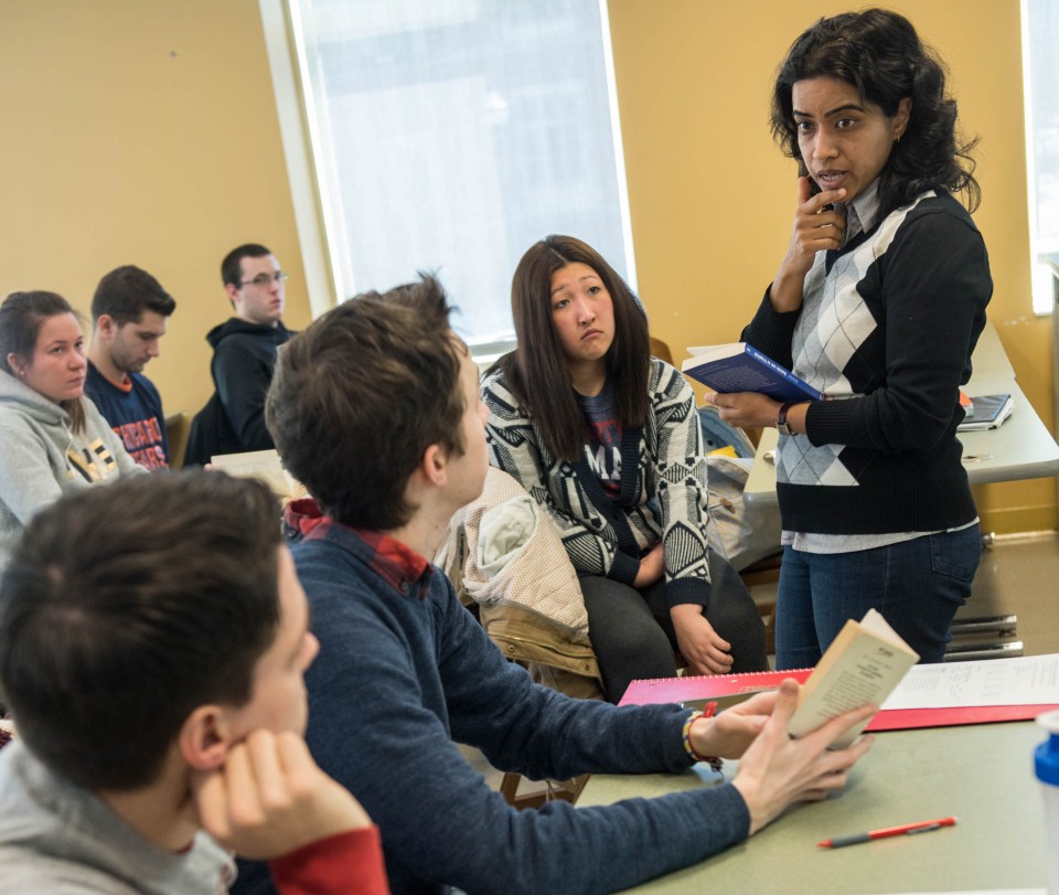 An instructor facilitates discussion with students.