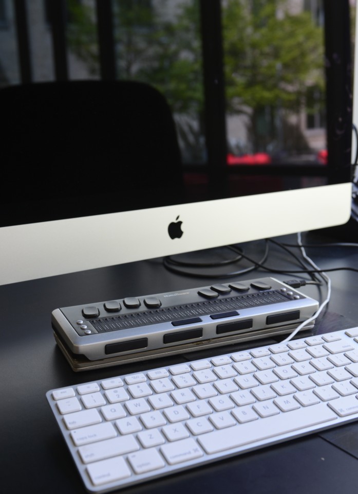 Mac desktop with assistive keyboard. 